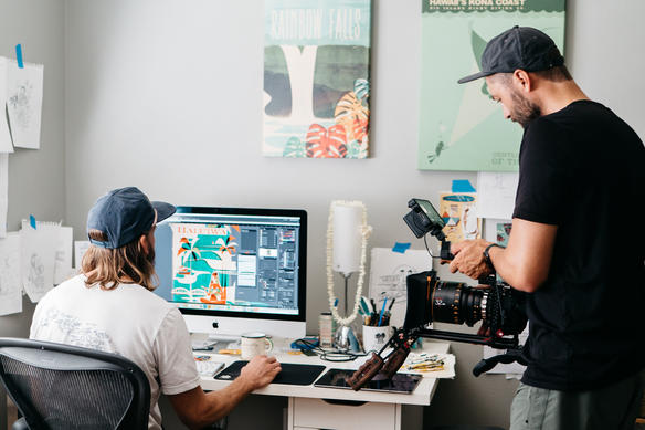 Andrew Rizer captures a shot of artist Nick Kuchar who is working at his computer