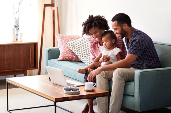 family sitting together in their living room