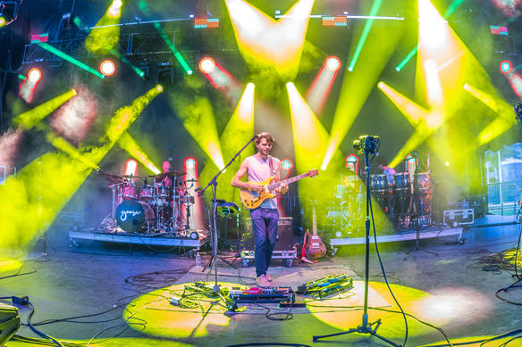 Goose performing live on stage with colorful lighting effects