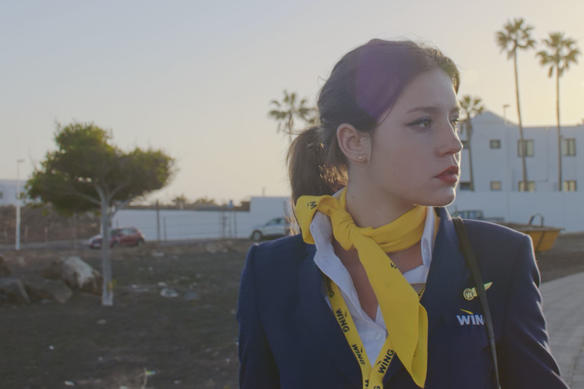 Actress Adèle Exarchopoulos looking screen right at sunset